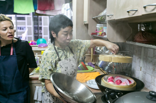 Local actress Jalyn Han as our bao-making auntie imparting skills of making longevity buns at the Flavours of Chinatown workshop to foreign visitors